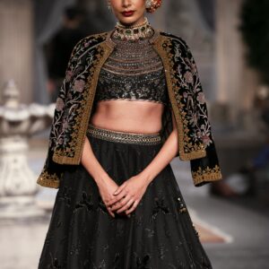 A Woman in Crop Top with Jacket Draped Around Shoulders